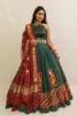 Dark Green Chaniya choli with mirror work dupatta and backless blouse